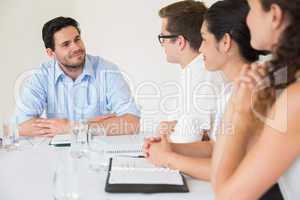 Confident businessman discussing in meeting
