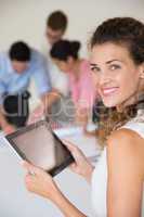 Beautiful businesswoman holding digital tablet