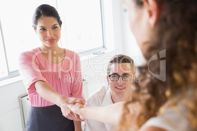 Businesswoman shaking hands with female partner
