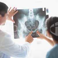 Nurse and doctor examining xray