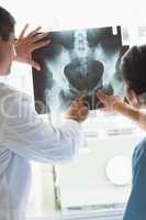 Doctor and nurse analyzing xray