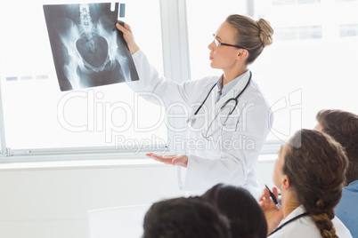 Doctor and colleagues examining Xray