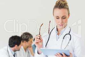 Female doctor using digital tablet