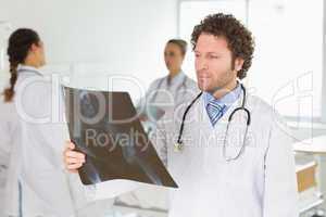 Male doctor checking Xray