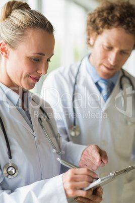 Female doctor writing clipboard