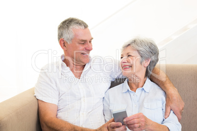 Couple using mobile phone