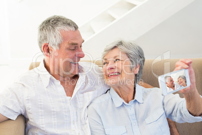 Senior couple taking selfie through cellphone