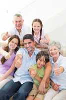Happy multigeneration family gesturing thumbs up