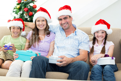 Happy family with Christmas presents