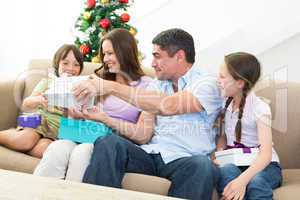 Family exchanging Christmas presents