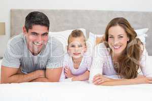 Happy family in bed