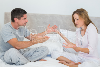 Frustrated couple in bedroom