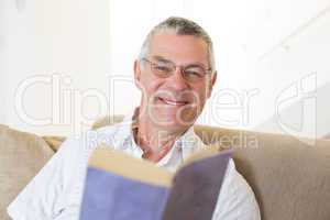 Handsome senior man with book