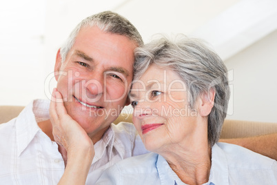 Senior woman touching husband