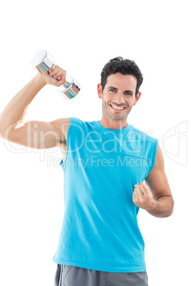 Portrait of a smiling man exercising with dumbbell Portrait of a smiling man exercising with dumbbell