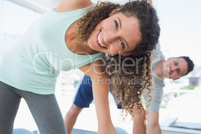 Woman stretching in exercise room