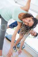 Woman stretching in health club