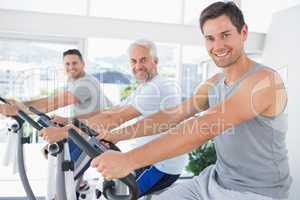 Men on exercise bikes