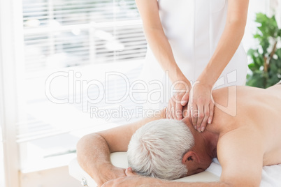 Senior man getting back massage