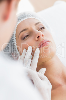 Woman recieving botox injection in upper lip