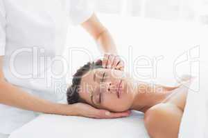 Woman receiving head massage
