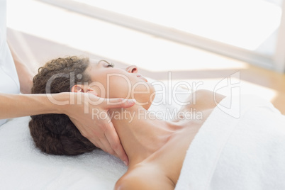 Woman receiving neck massage