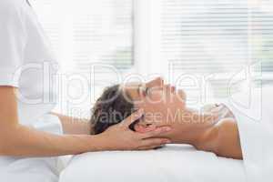 Woman receiving body massage in health spa