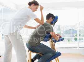 Man receiving massage from physiotherapist