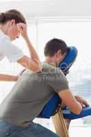 Man receiving massage from therapist