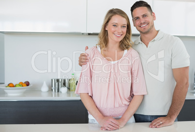 Couple standing at kitchen counter