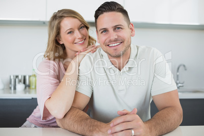 Loving couple at kitchen counter