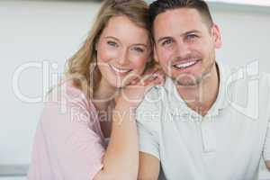 Couple smiling in kitchen