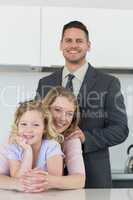 Family smiling together at table