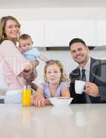 Family at breakfast table in house