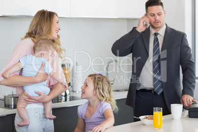 Family of four at breakfast table