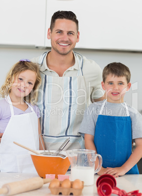 Portrait of family baking cookies