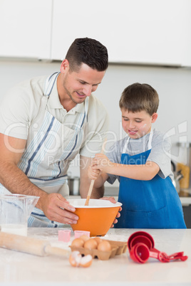 Father and son baking cookies