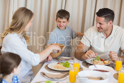 Family eating lunch at dining table