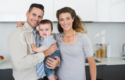 Smiling parents with cute baby boy