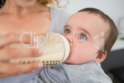 Mother feeding milk to baby