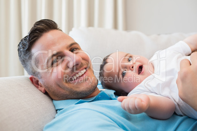 Father with baby at home