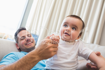 Happy father with baby at home