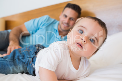 Baby with father in bed