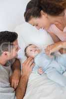 Caring parents with baby boy