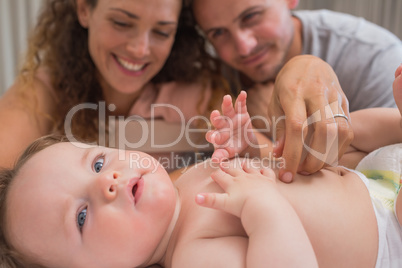 Loving parents looking at baby
