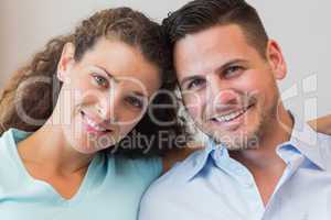 Smiling young couple at home