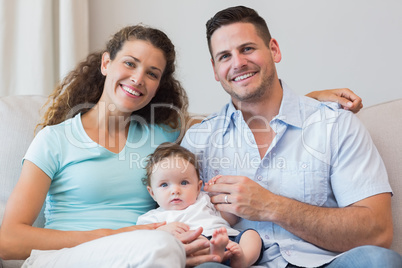 Smiling parents with baby boy
