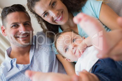 Smiling parents with cute baby