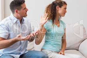 Couple arguing in living room