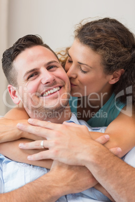 Romantic woman kissing man